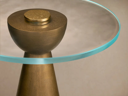 Front view of the Beaufort Glass Top Martini Table with an Antique Brass conical base and a clear glass top.
