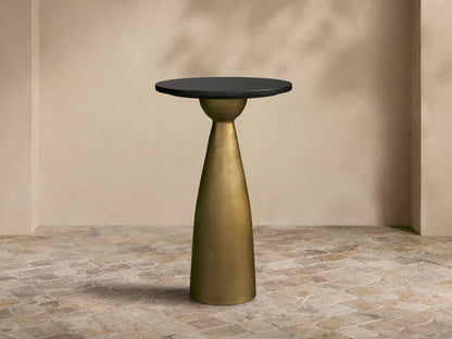 Front view of the Beaufort Martini Table with a round black granite top and a conical Antique Brass base.