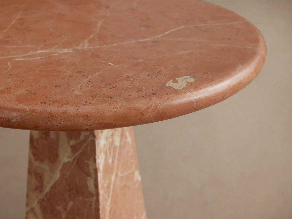Front view of the C-shaped Brecken Indoor Only Martini Table, featuring a mosaic of varied brown and cream natural marble.