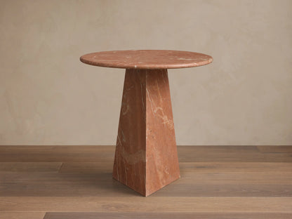 Front view of the reddish-brown marble Brecken End Table with a round top, tapering faceted base, and white veining.