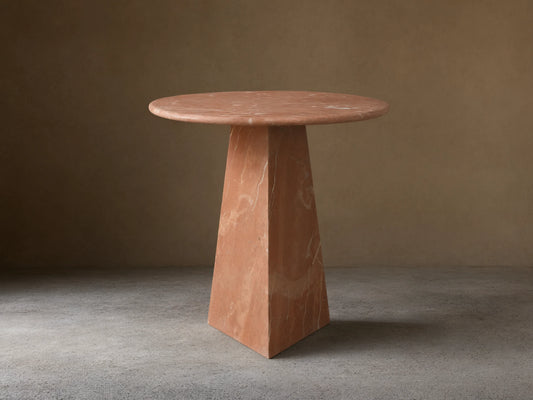 Front view of the reddish-brown marble Brecken End Table with a round top, tapering faceted base, and white veining.