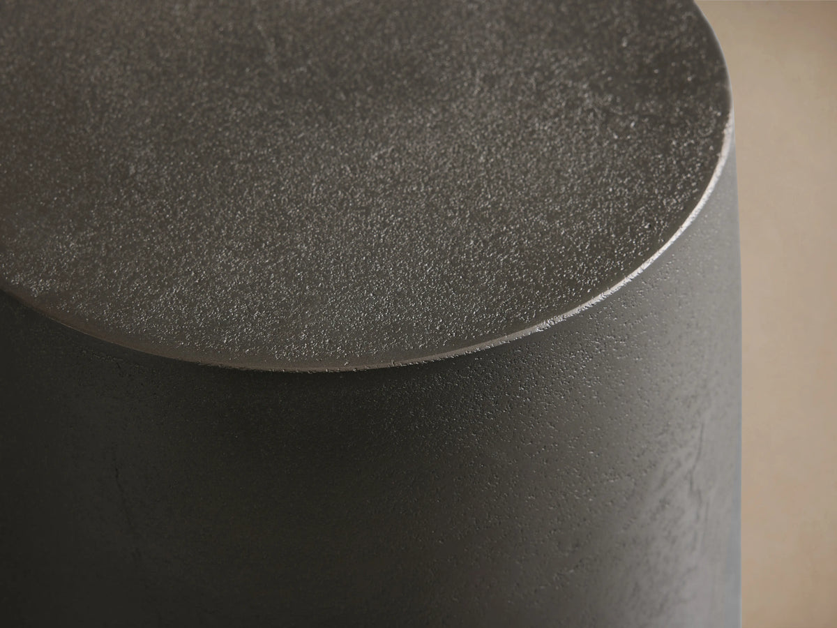 Hammered Drum End Table with a smooth, round top and textured surface, made from hand-pounded, antiqued aluminum.