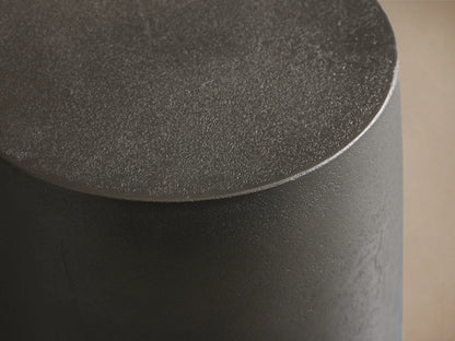 Hammered Drum End Table with a smooth, round top and textured surface, made from hand-pounded, antiqued aluminum.