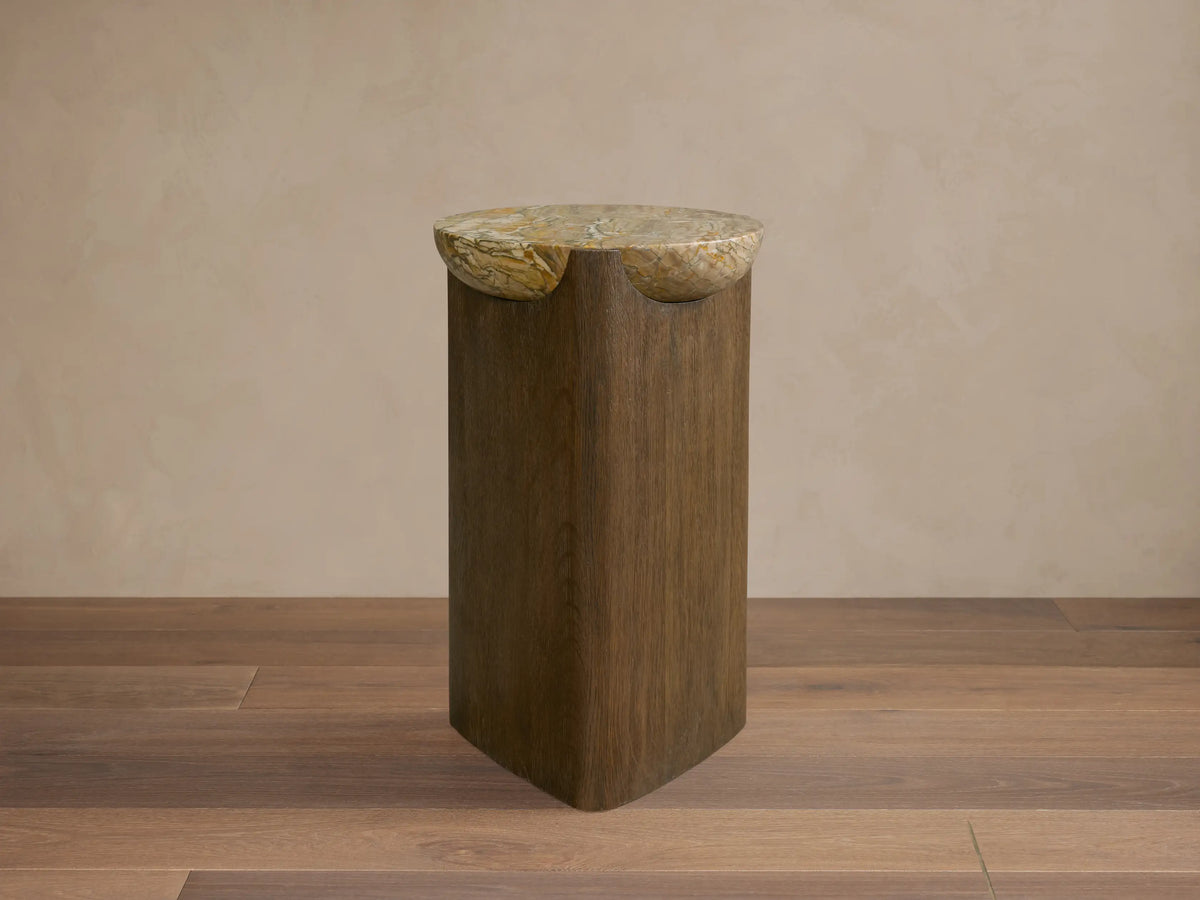 Bellino Martini Table: Dark oak base with softly rounded triangular shape. Light marble top with natural, intricate veining.