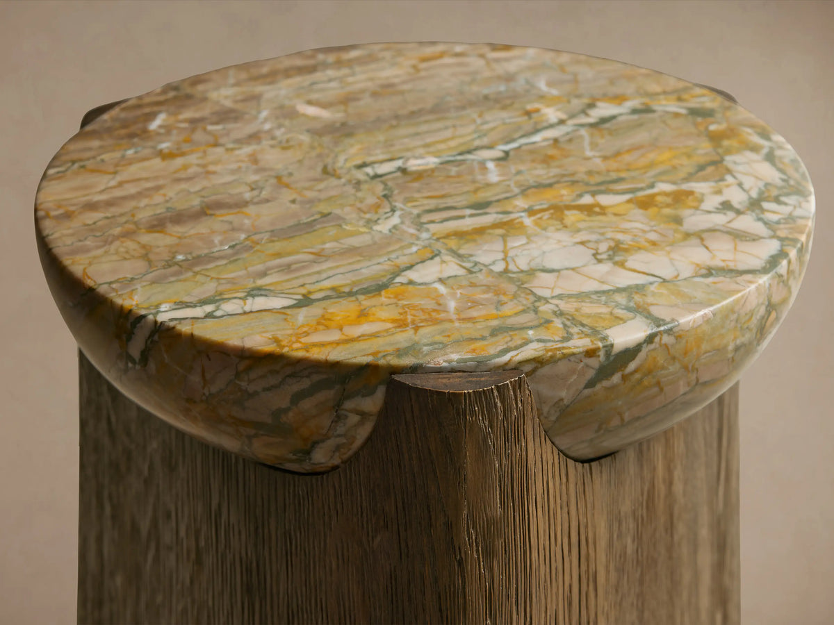 Bellino Martini Table: Dark oak base with softly rounded triangular shape. Light marble top with natural, intricate veining.