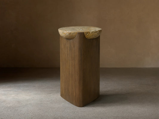 Bellino Martini Table: Dark oak base with softly rounded triangular shape. Light marble top with natural, intricate veining.