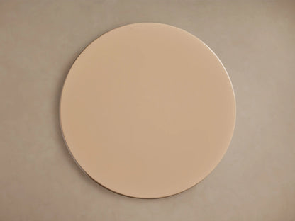 Alt text: Close-up of the Bridgers Lacquer Stool showing its smooth, high-gloss beige finish and sleek, curved silhouette.