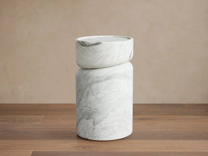 Mayer Martini Table with a modern column silhouette, carved detailing, and gray veining on smooth, white natural stone.