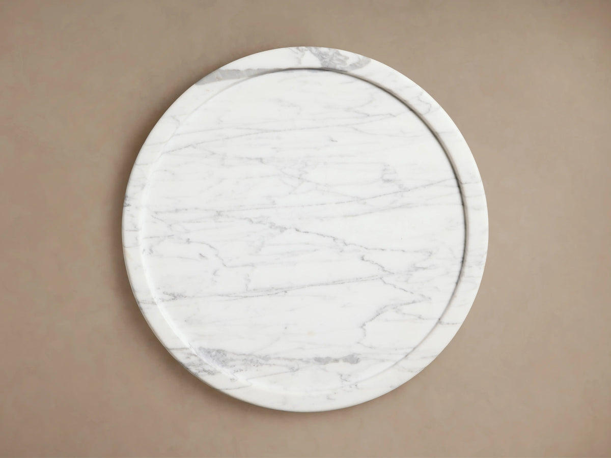Mayer Martini Table crafted from natural stone, displaying white and gray veining. Rounded top with subtle edge detail.
