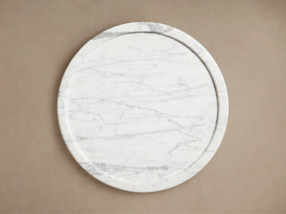 Mayer Martini Table crafted from natural stone, displaying white and gray veining. Rounded top with subtle edge detail.