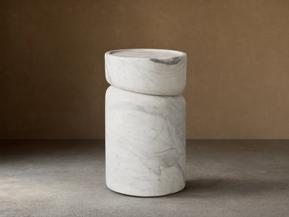 Mayer Martini Table with a modern column silhouette, carved detailing, and gray veining on smooth, white natural stone.