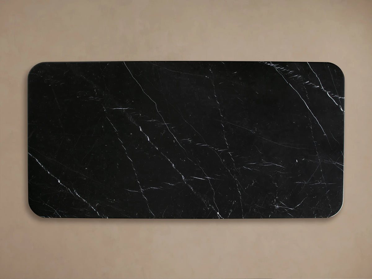 Close-up of Caden Coffee Table corner with black Marquina stone top, white veins, and dark walnut wood veneer base.