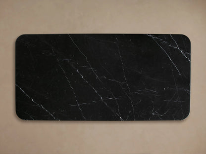 Close-up of Caden Coffee Table corner with black Marquina stone top, white veins, and dark walnut wood veneer base.