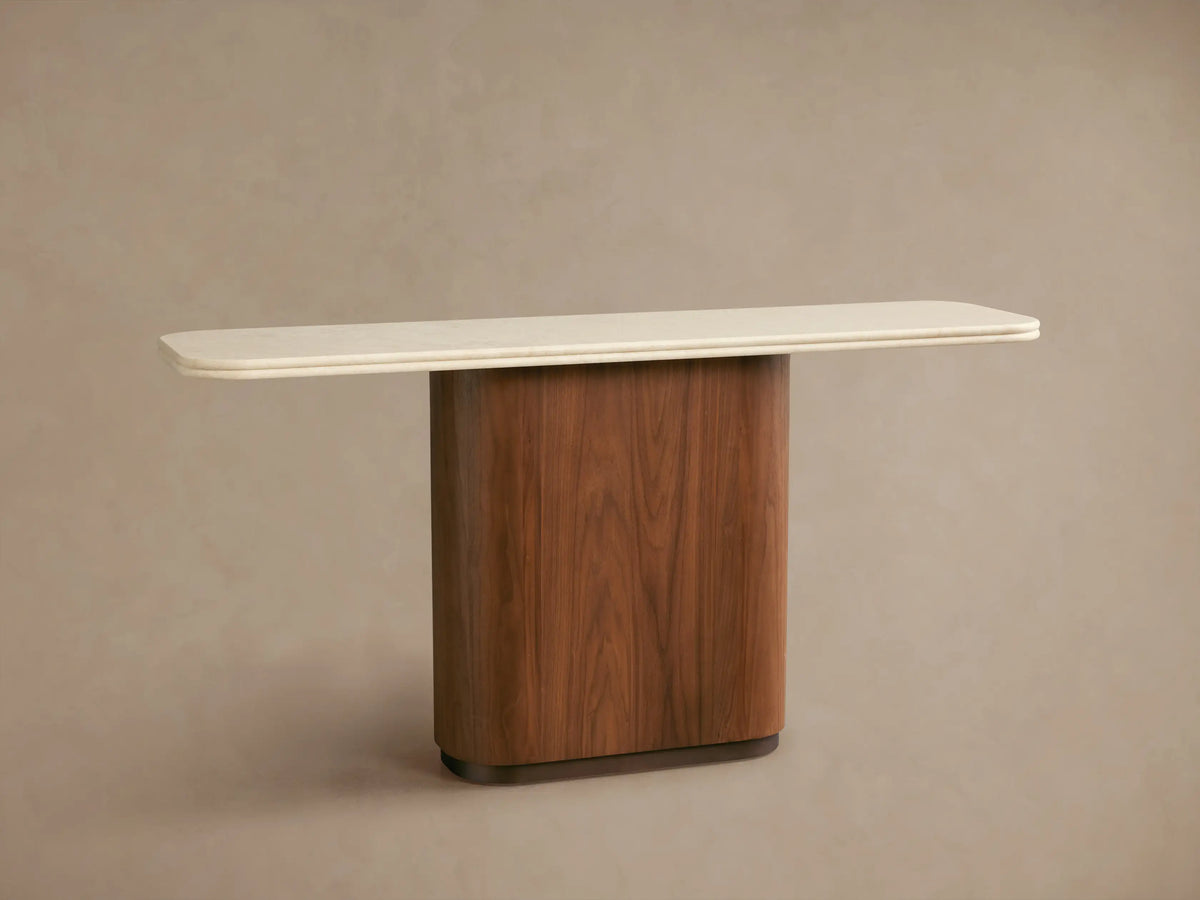Close-up of Caden Console Table's cream stone top with rounded edge, showcasing its dark walnut wood veneer base.