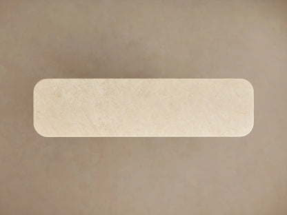 Caden Console Table with a curved walnut wood base, dark plinth, and cream stone top, on a neutral background.