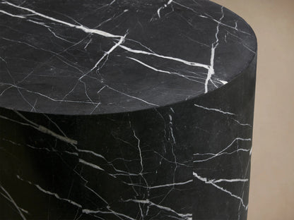 Cylindrical Cinzia Stone End Table with a smooth, dark surface featuring white veining patterns, creating an elegant, natural look.