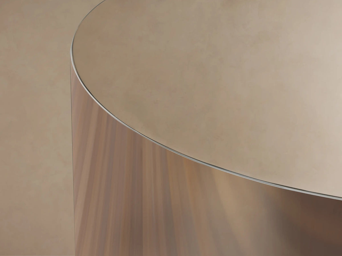 Front view of the Cinzia Chrome Round End Table, a cylindrical piece with a radiant, polished, mirror-like finish and a plinth-style base.