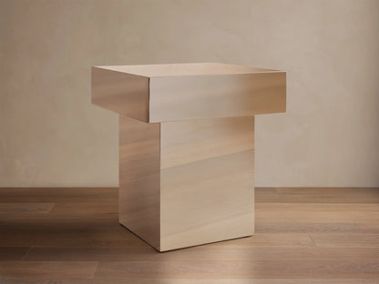 Front view of Cinzia Chrome End Table, featuring a rectangular chrome top and a light wood plinth base.