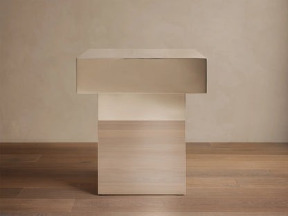 Front view of Cinzia Chrome End Table, featuring a rectangular chrome top and a light wood plinth base.
