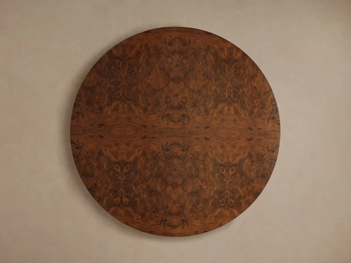 Cinzia Burl Round Coffee Table, top view. Dark brown walnut burl wood with an intricate, symmetrical grain pattern.