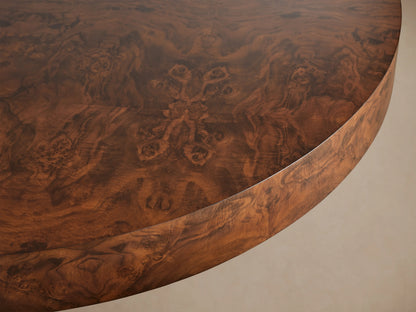 Cinzia Burl Round Coffee Table, low-profile with dark brown walnut burl wood and intricate swirling grain patterns, on a plinth base.