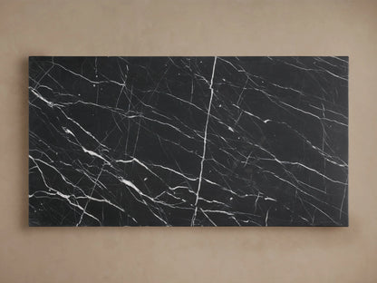 Cinzia Stone Coffee Table featuring a black marble top with white veining details, showcasing a low-profile, plinth-style design.