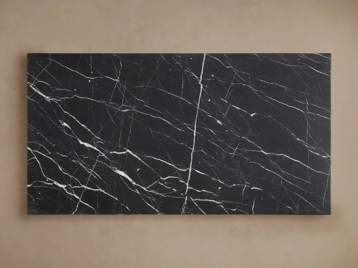 Cinzia Stone Coffee Table with a rectangular black marble surface, featuring white veining patterns. The marble has a smooth finish.