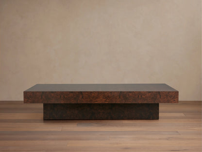 Cinzia Burl Coffee Table, rectangular and low-profile, made of dark brown walnut burl wood veneer with a distinct grain pattern, on a wooden floor.