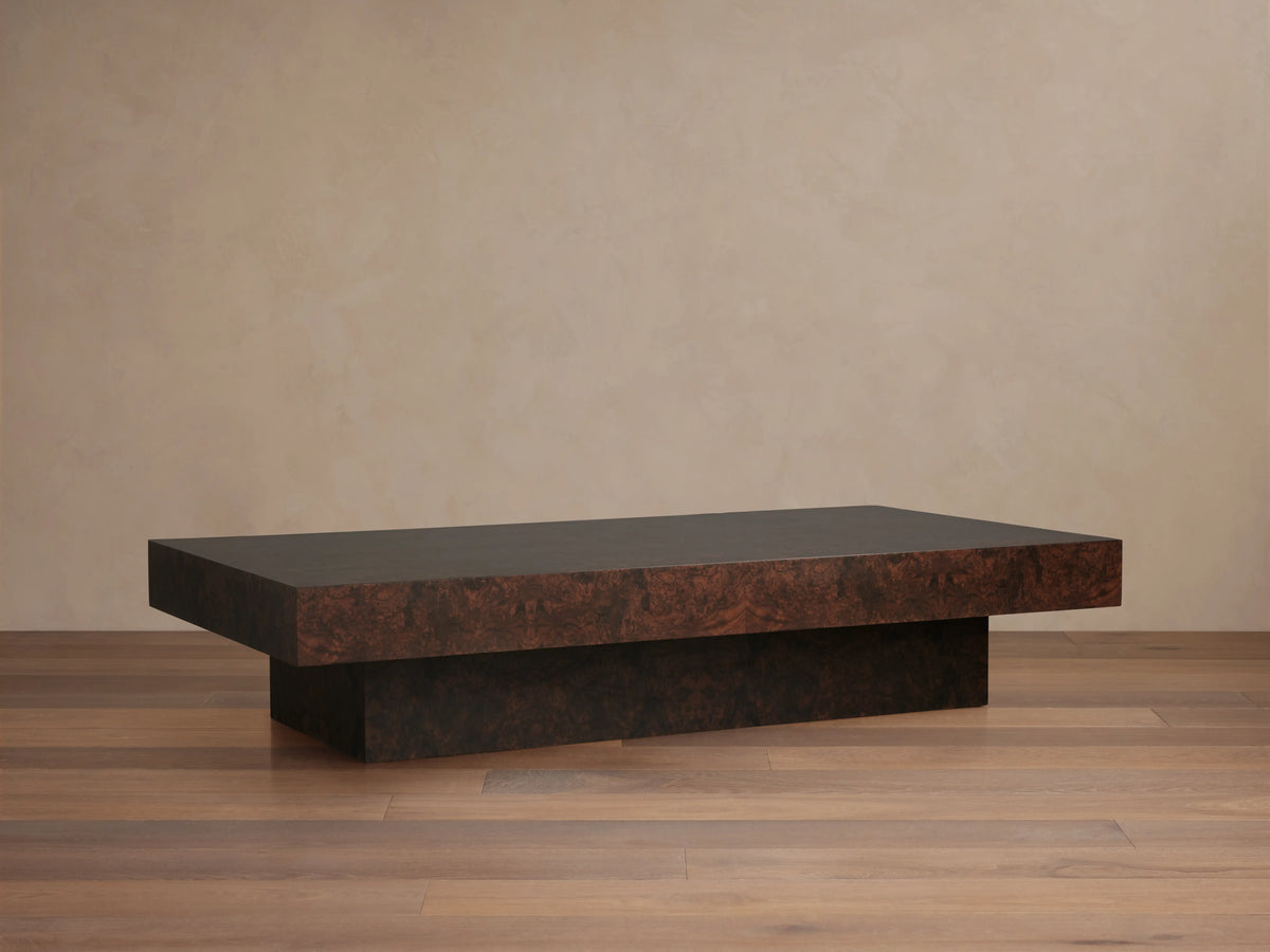 Cinzia Burl Coffee Table, rectangular, low-profile, dark brown walnut burl wood with unique patterns, on a plinth base.