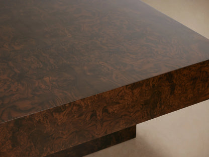 Cinzia Burl Coffee Table with a low-profile, rectangular design, walnut burl veneer, plinth-style base on wood floor.