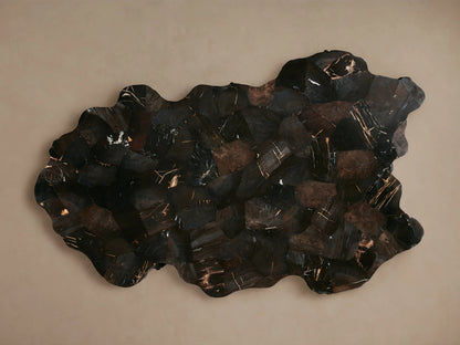 Clayhill Coffee Table with a rustic, dark petrified wood finish, irregular edges, and a polished surface, resting on a wooden floor.