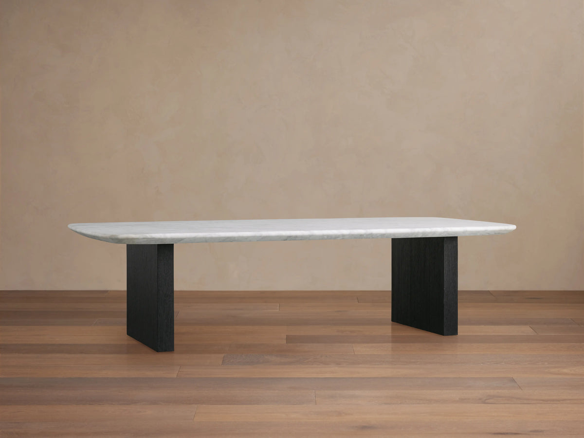 Saint Germain coffee table with a rectangular Carrara marble top, featuring light gray veining on a neutral background, viewed from above.