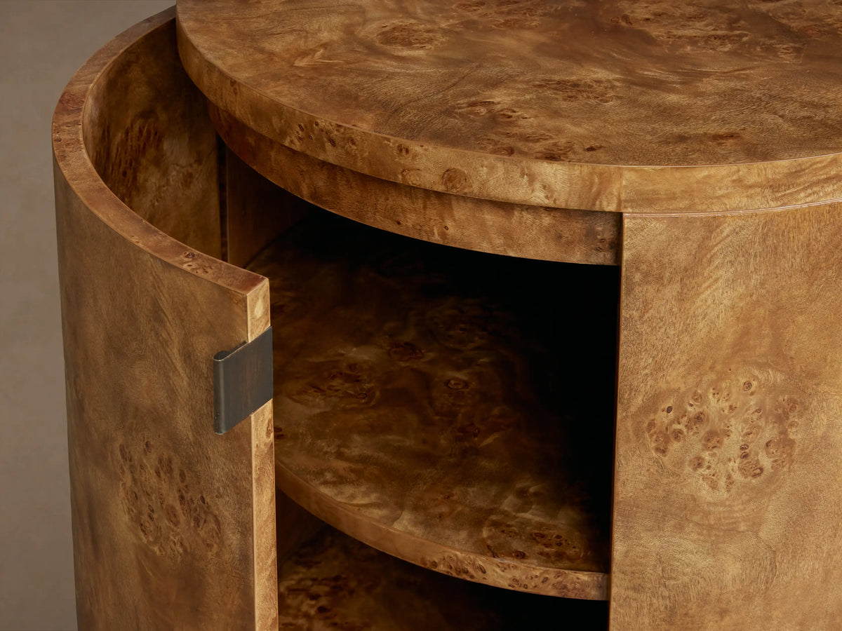 Corey Storage End Table: Cylindrical, warm brown mappa burl wood, featuring a door with an antiqued bronze handle.