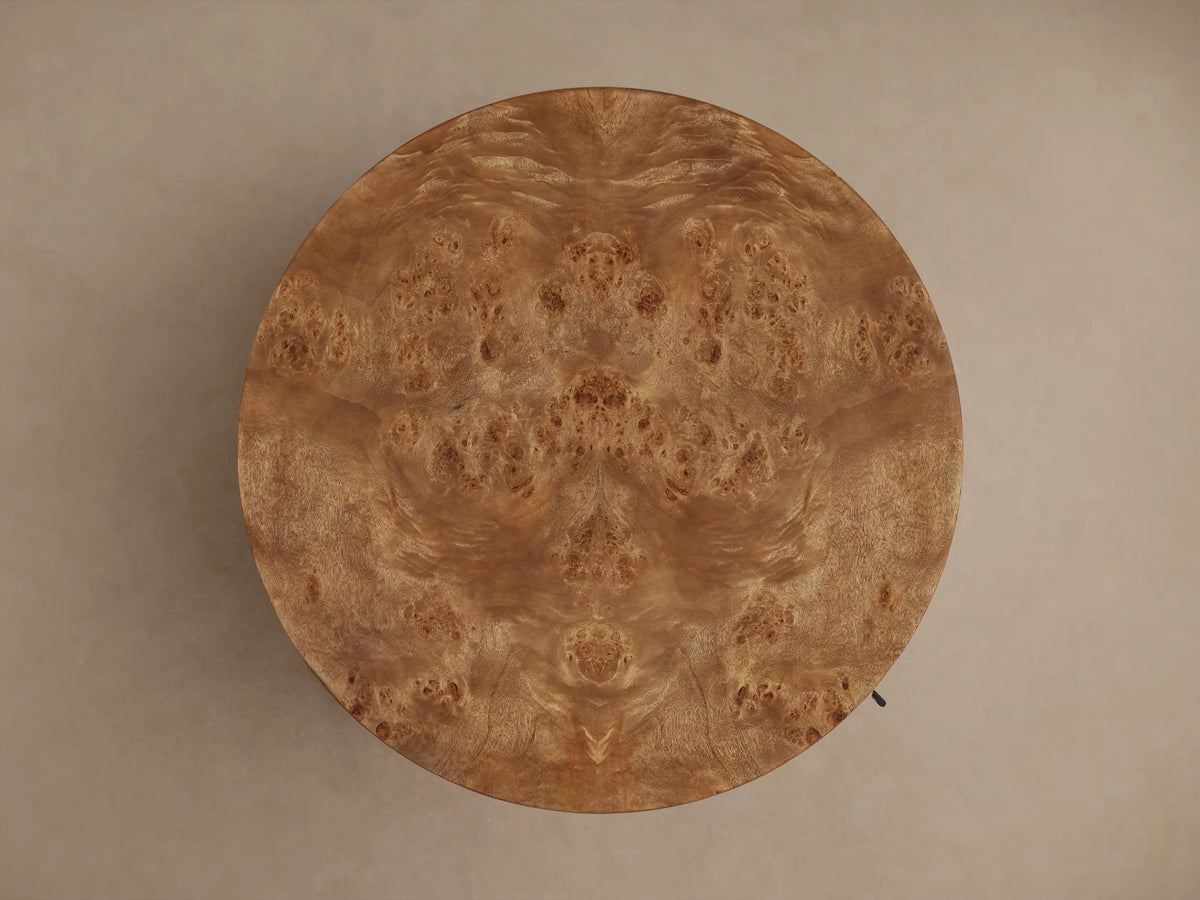Close-up of Corey Storage End Table, door slightly open. Shows the round table's rich brown mappa burl wood and interior shelf.