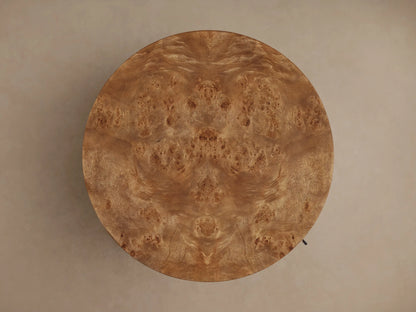 Close-up of Corey Storage End Table, door slightly open. Shows the round table's rich brown mappa burl wood and interior shelf.