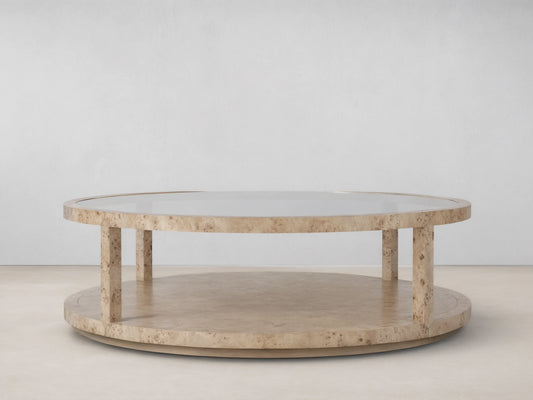 Corey Round Coffee Table in light brown mappa burl wood finish, with circular top and lower shelf connected by vertical supports.