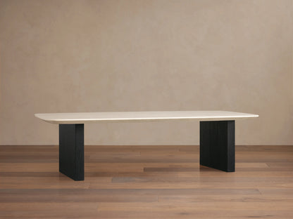 Stone top coffee table with a creamy Carrara marble surface and flat edges. Supported by two rectangular ebony-finished wooden bases.