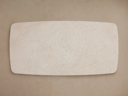 Rectangular cream marble tabletop of the Saint Germain Coffee Table, showcasing natural variations in color and pattern on a neutral background.