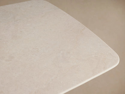 Saint Germain Coffee Table features a Carrara marble top with natural variations and rounded edges, showcasing a smooth beige surface.