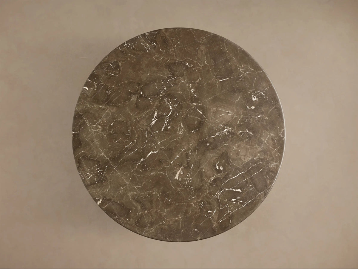 Top-down view of the espresso brown stone Saint Germain Round Coffee Table with Dauphine Base, showing white veining.