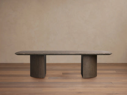 The image shows a rectangular Carrara marble tabletop with rounded corners and grey veining, set against a neutral background.