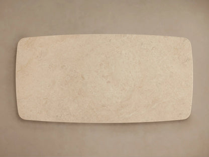 Front view of the light beige Saint Germain Stone Coffee Table with Dauphine Base, featuring a rounded stone top and two curved light oak bases.