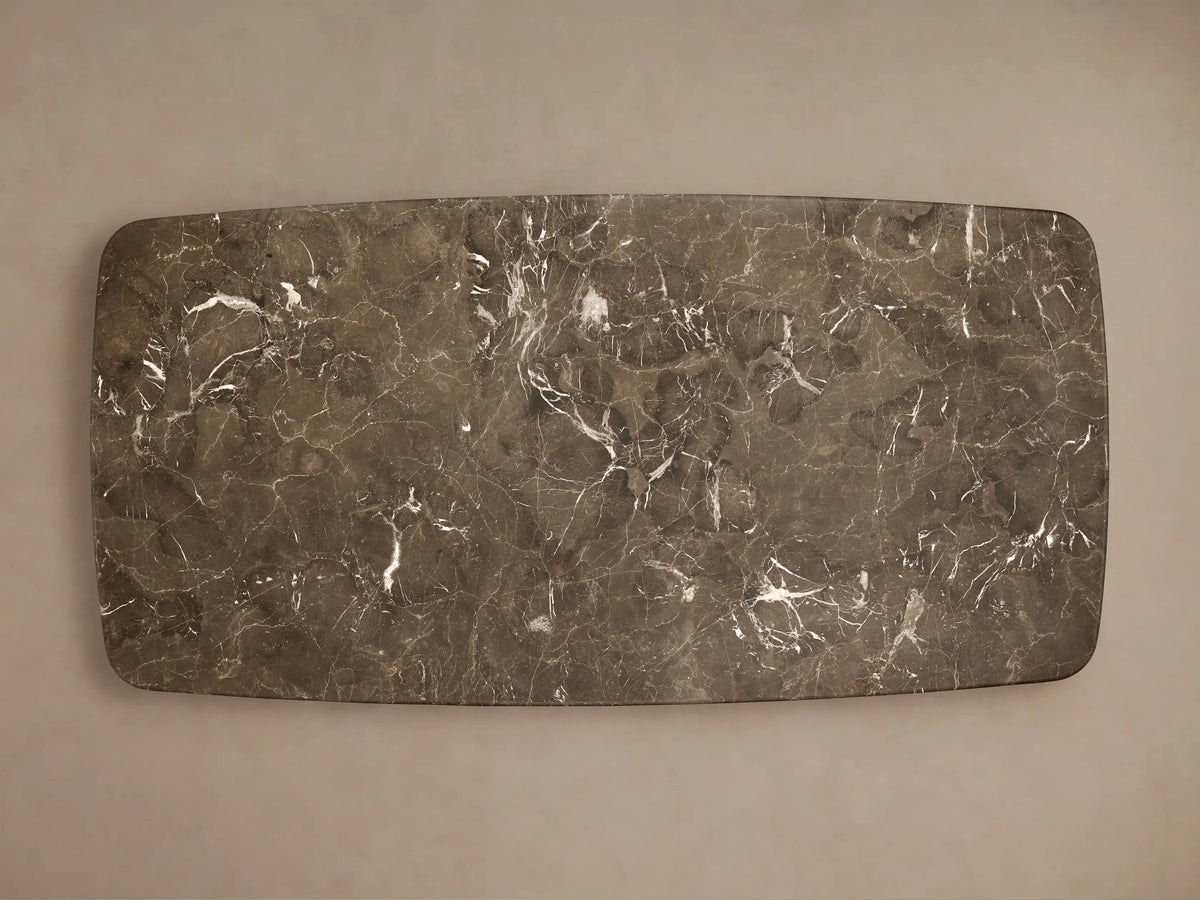 Close-up of the honed dark brown marble tabletop of the Saint Germain Stone Coffee Table with Dauphine Base, showing white veining.