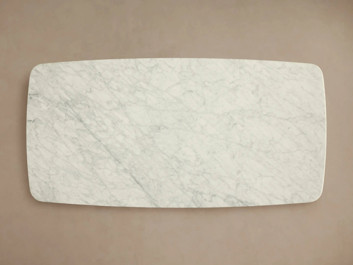Front view of the Saint Germain Coffee Table with Dauphine Base, featuring an oblong Carrara marble top and two dark wood bases.