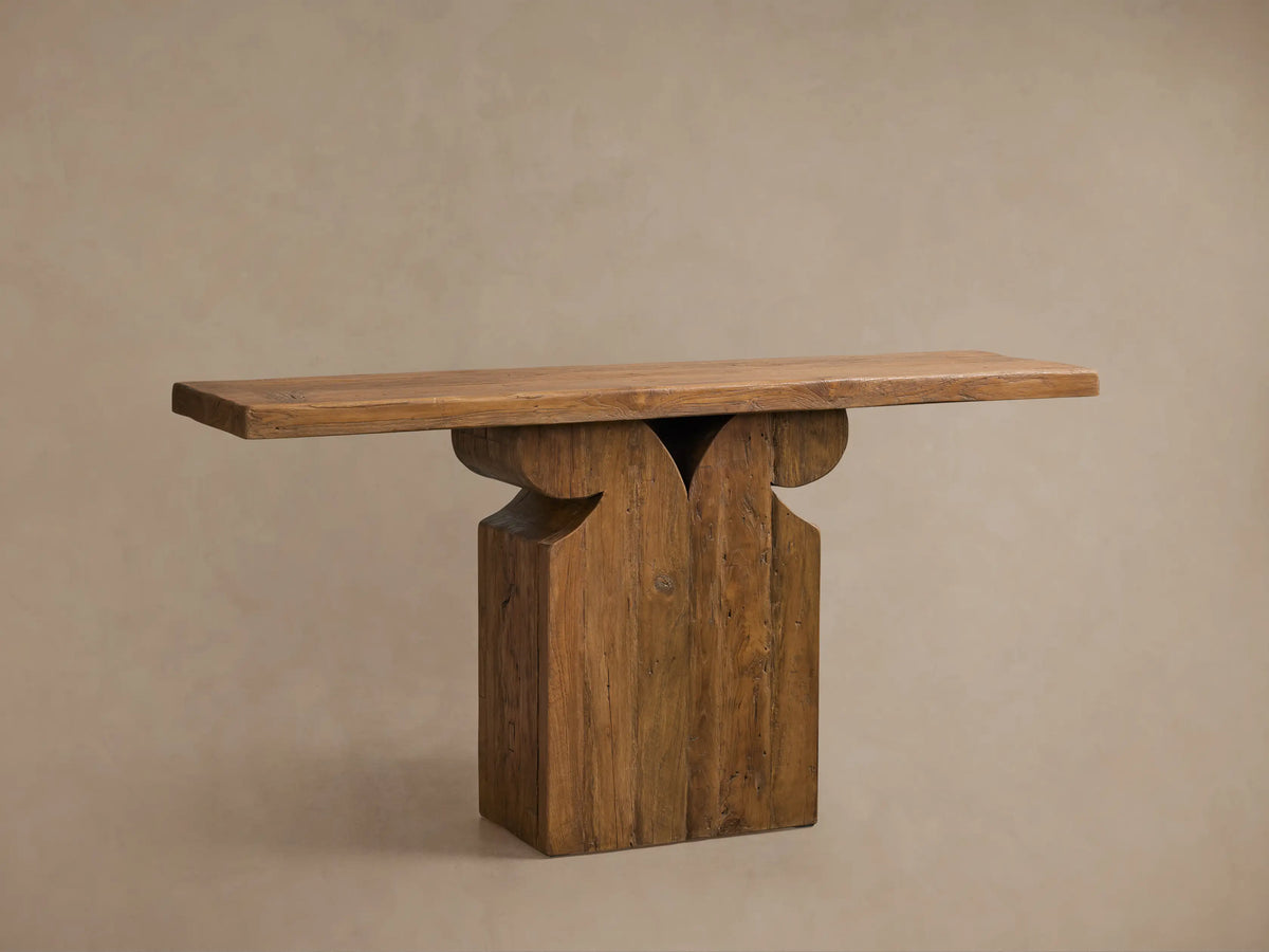 Front view of the warm brown Dumai Console Table, made from reclaimed teak with a curved wall-mounted support.