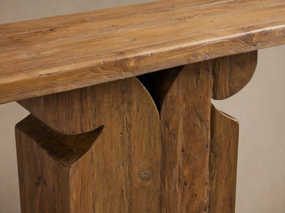 Dumai Console Table with a rustic wooden surface and geometric base against a neutral background.