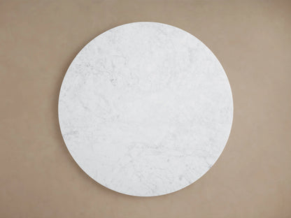 Round white Carrara marble top of Danny Coffee Table, featuring natural veining patterns, viewed from above.