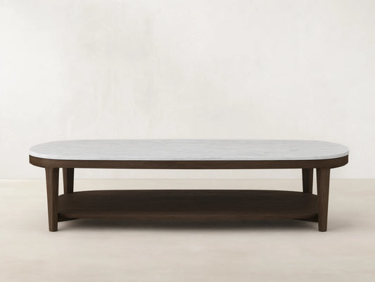 Front view of Oval Marble Top Coffee Table, with a white marble top and dark brown wooden frame including a lower shelf.