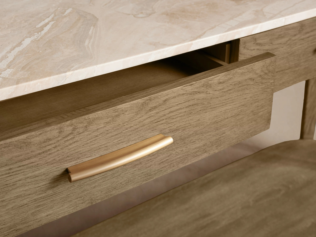 Danny Console Table with oak wood frame in fawn finish, two drawers with brass pulls, and ivory-toned marble top.