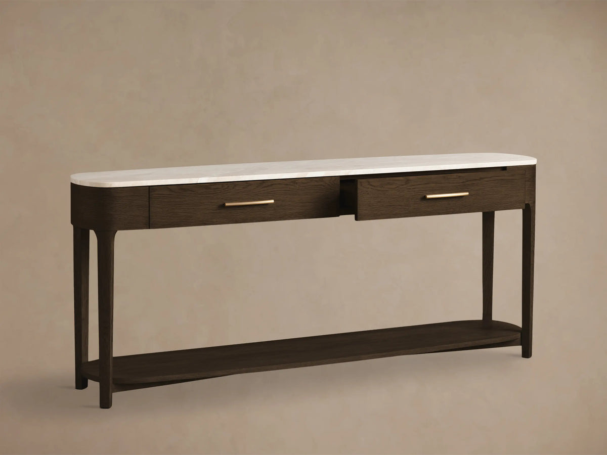 Front view of a dark brown wood console table with a white marble top, two drawers with brass pulls, and a lower shelf.
